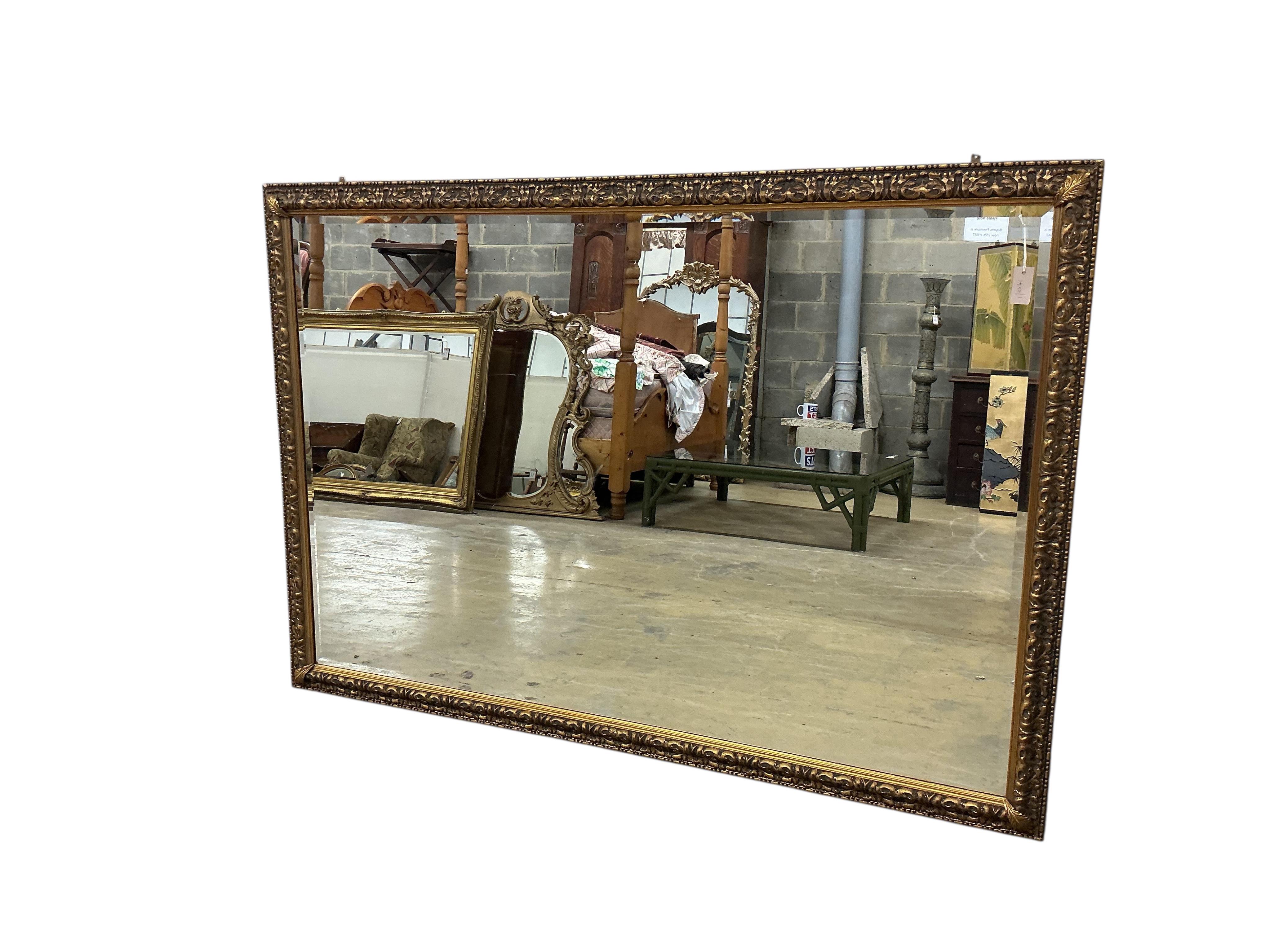 A large Victorian style rectangular gilt framed wall mirror, width 197cm, height 136cm